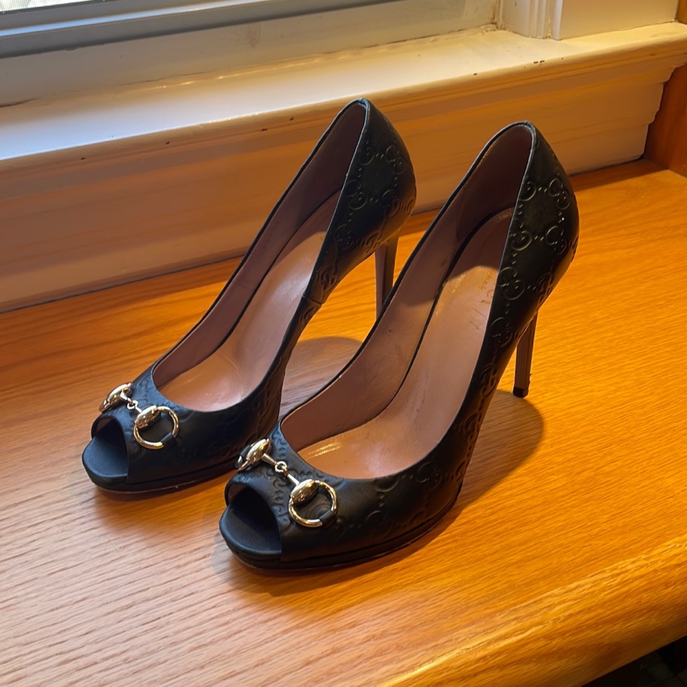 Gucci brand heels. Black monogram leather with gold hardware. Size 38.5